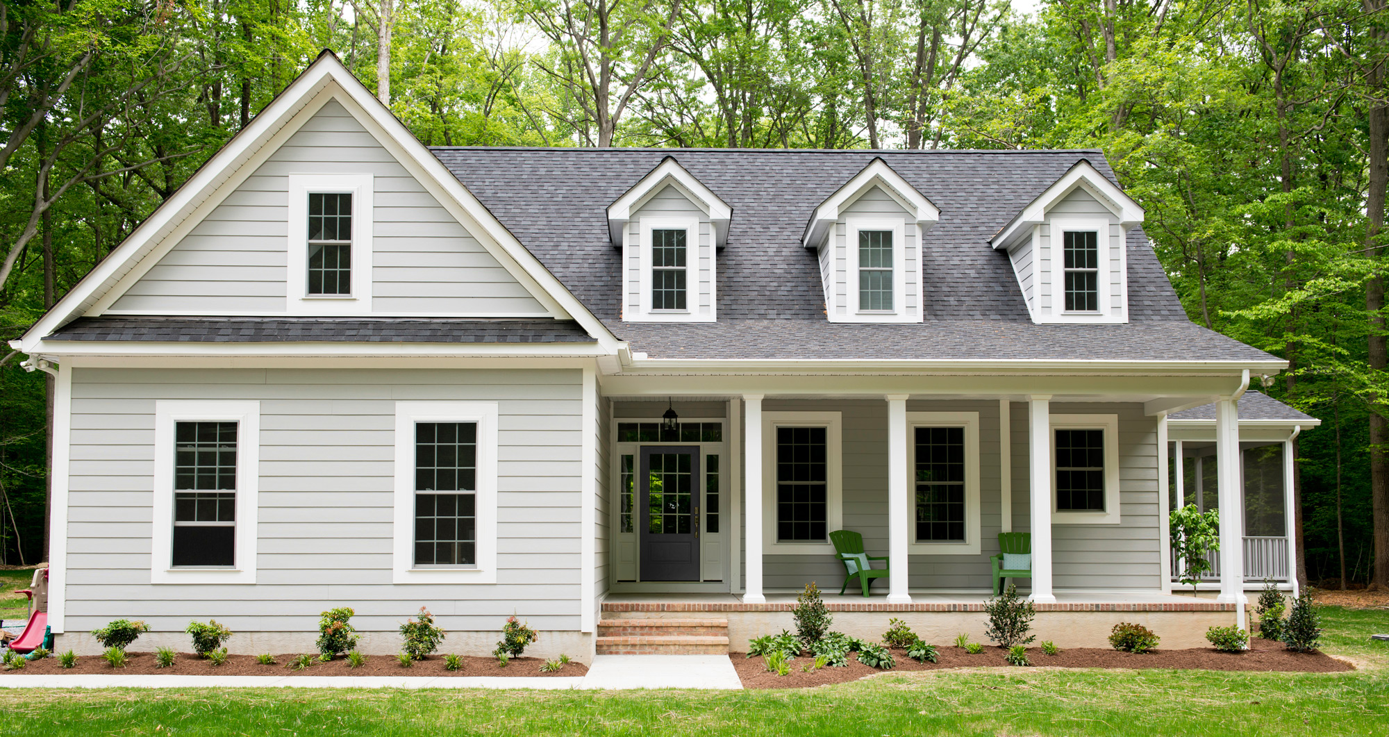 cape style home with gray lap siding 